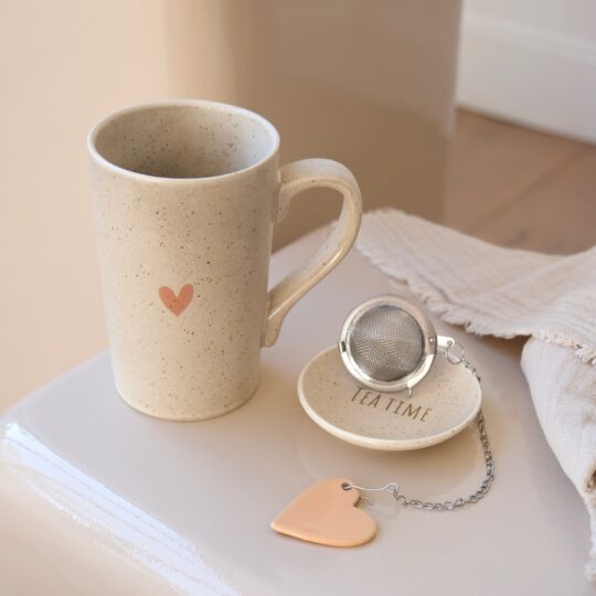 tasse à thé porcelaine soucoupe et boule à thé