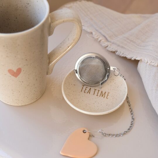 tasse à thé porcelaine soucoupe et boule à thé